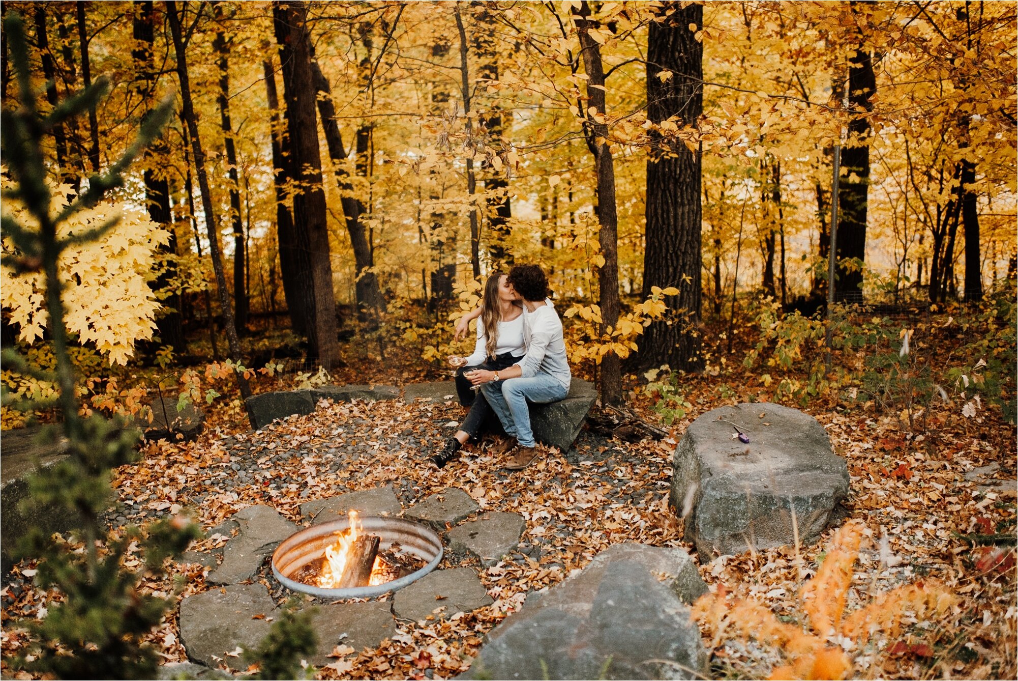  minnesota fall canoe engagement session karly jack bride groom firepit fireside cuddling campfire 